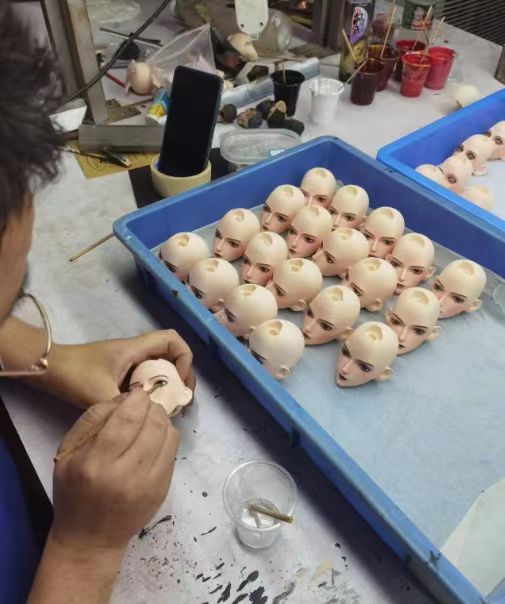 LORIBEAR figure heads being painted by hand